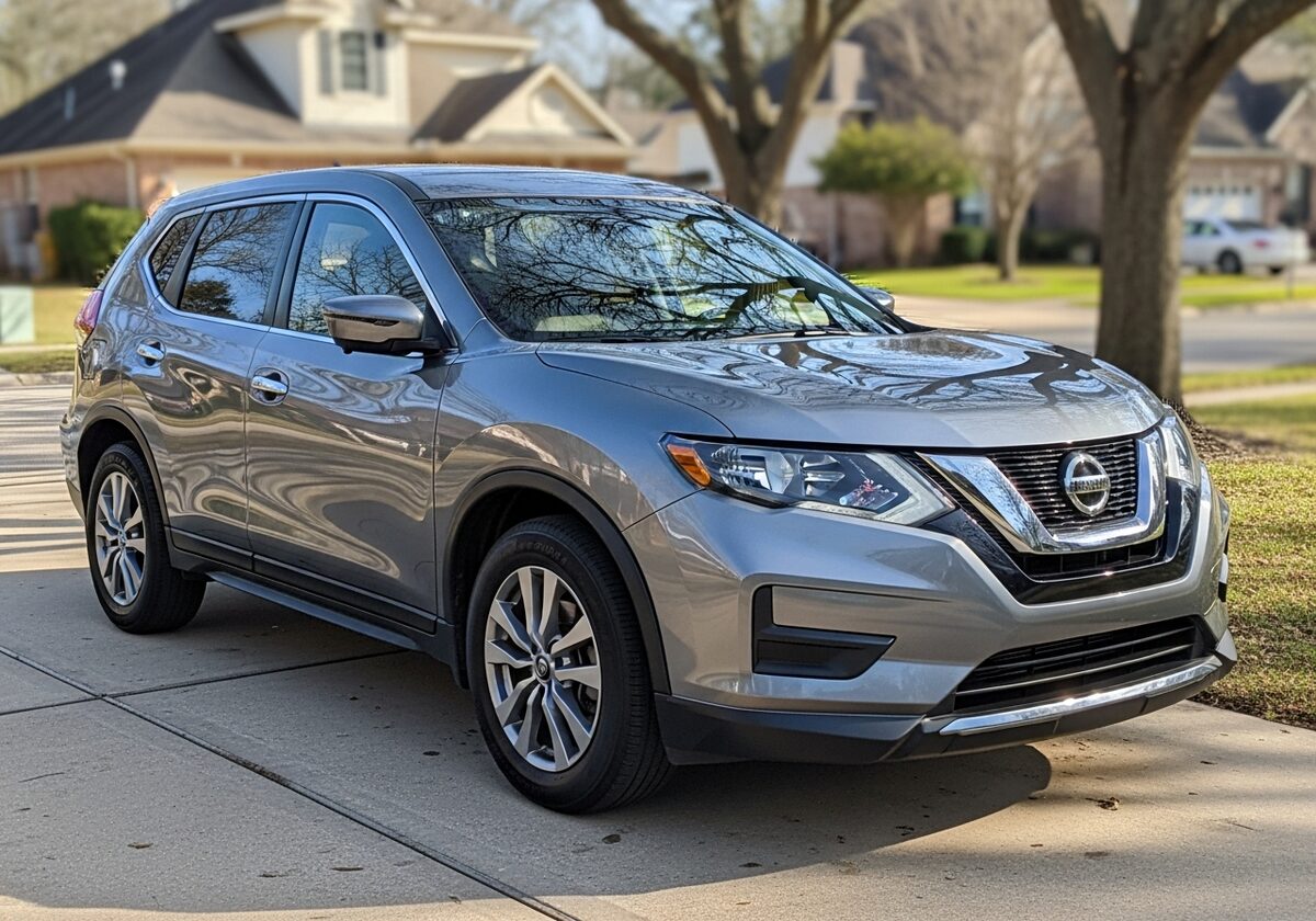 Gray Nissan Rogue SUV in a Houston driveway served by Texan Locksmith mobile key replacement