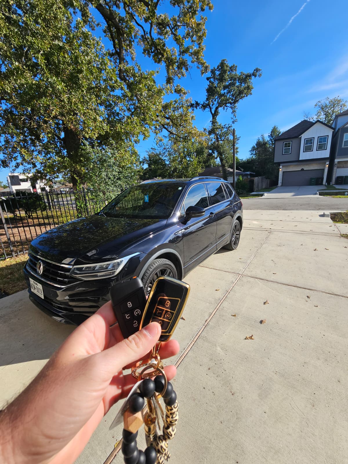 Volkswagen Tiguan key replacement at customer location , new VW smart key fob in hand, Houston TX